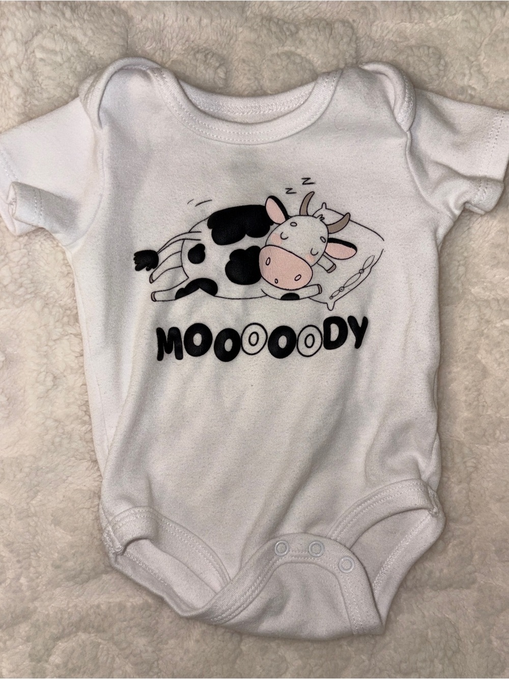 White 'Moooody' Cow Graphic Baby One-Piece